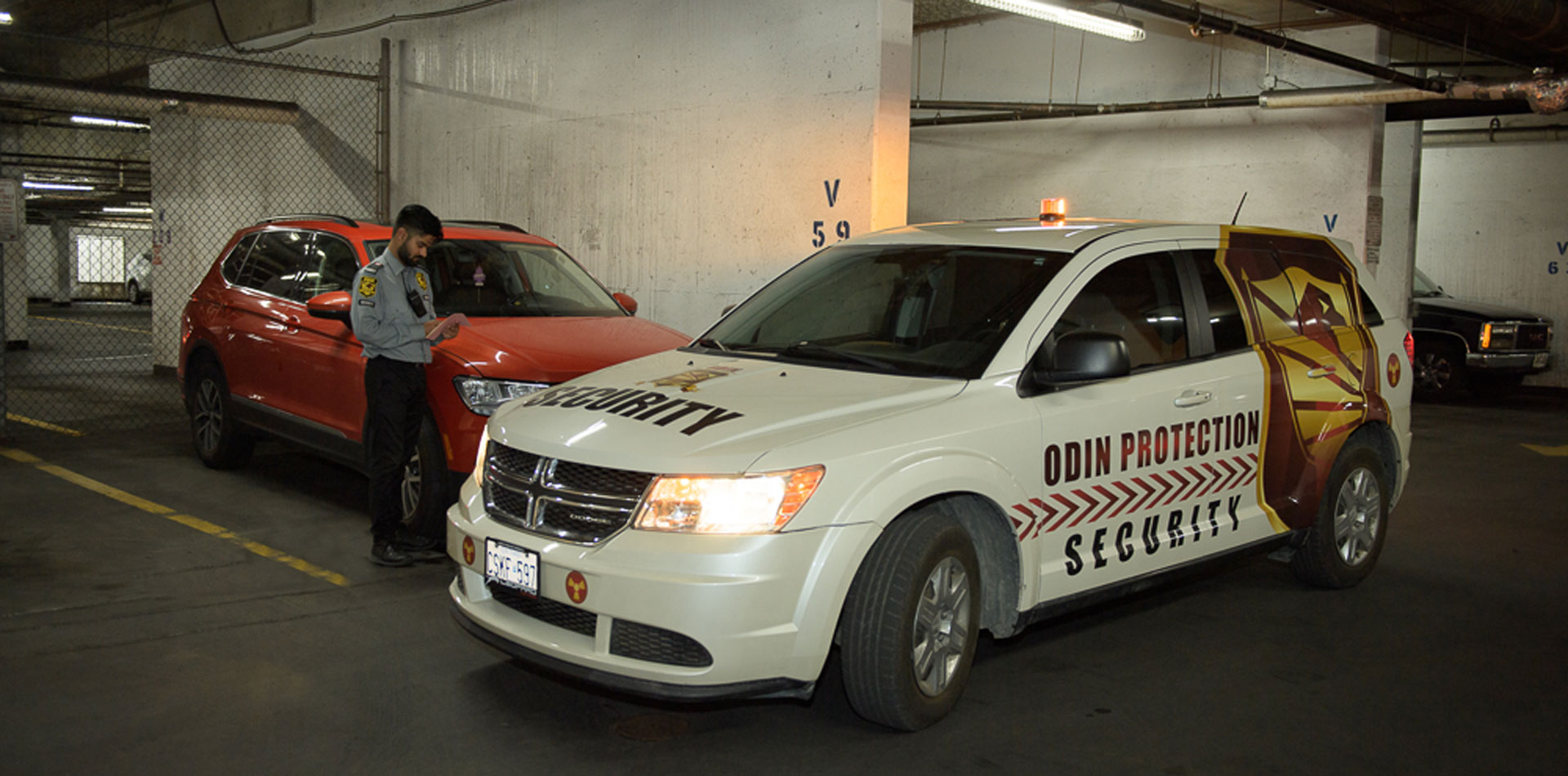 Odin Protection security guard monitoring a commercial parking lot in Toronto